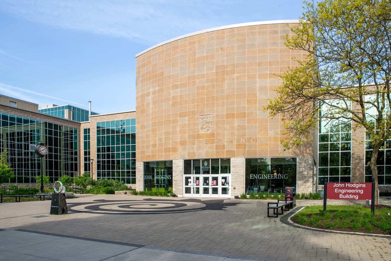 Front view of JHE with the iron ring and the building sign.