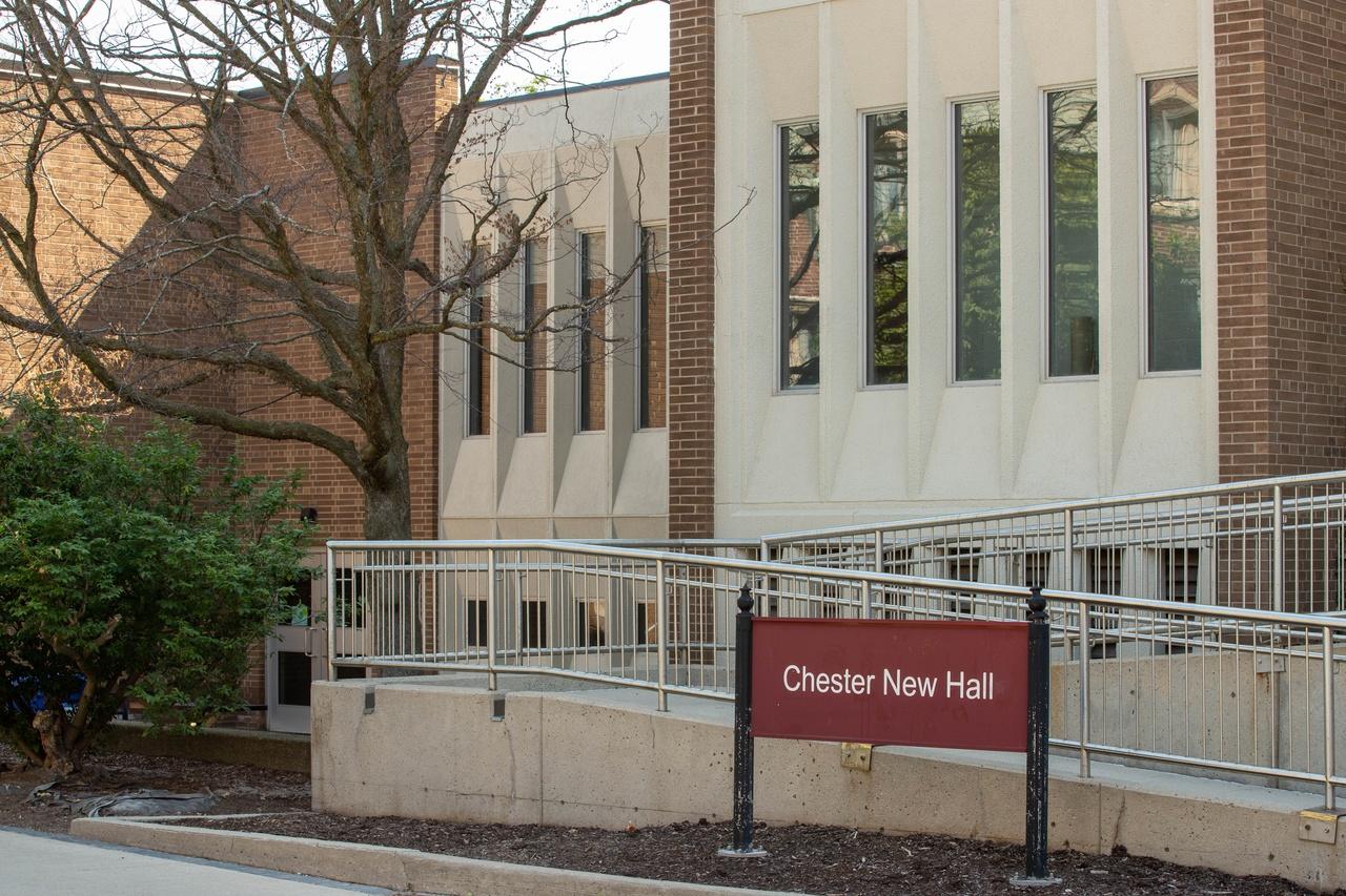 Close up of the CNH building sign in front of the wheelchair ramp.