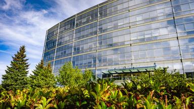 Angled view of the David Bradley Research Institute with greenery.